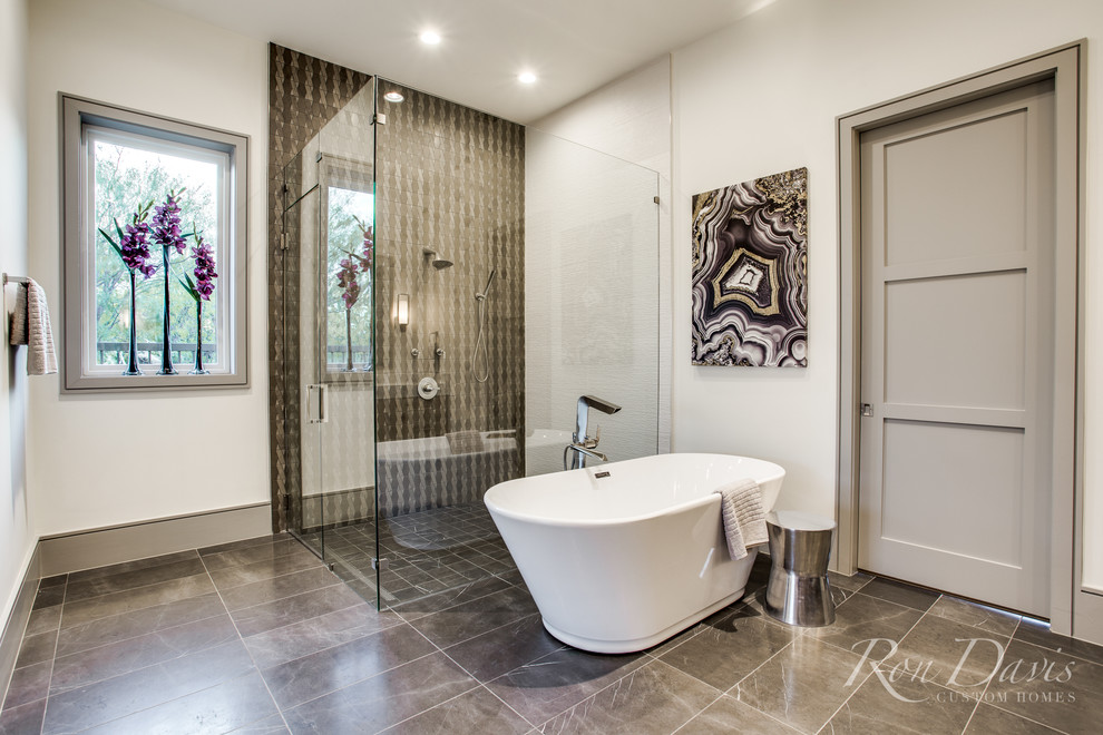 Inspiration for a large modern master bathroom in Dallas with a freestanding tub, a corner shower, black and white tile, porcelain tile, white walls, porcelain floors, black floor and a hinged shower door.