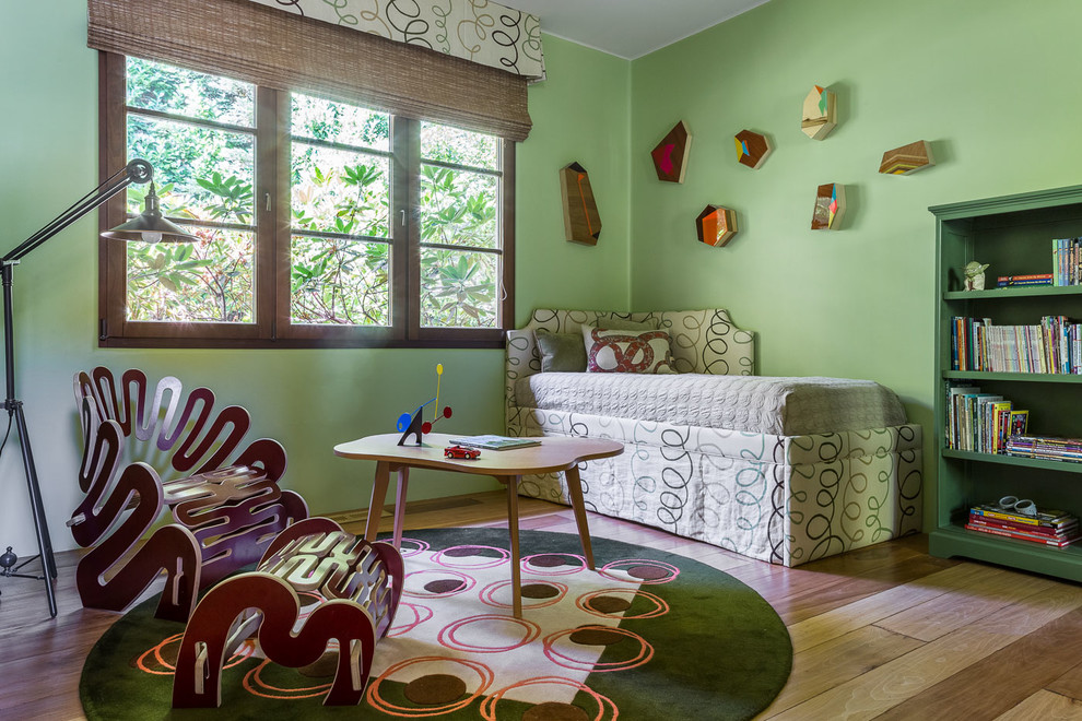 Photo of a large eclectic kids' room in San Francisco with yellow walls, light hardwood floors and yellow floor.