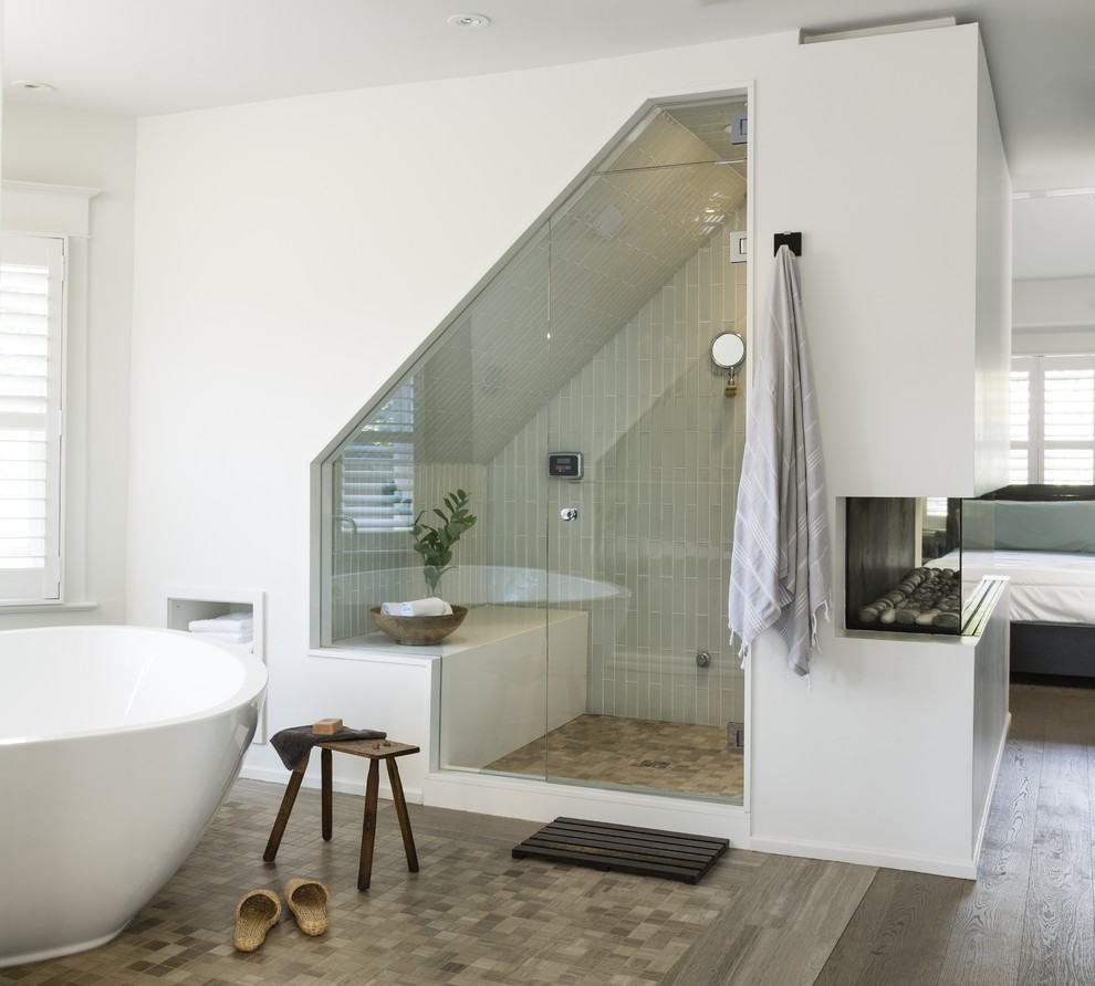 Inspiration for an expansive contemporary master bathroom in Toronto with engineered quartz benchtops, a freestanding tub, an alcove shower, white tile, glass tile, white walls and limestone floors.