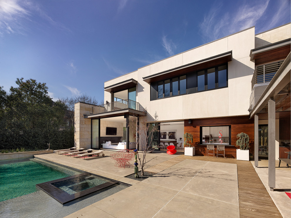 North Dallas - Patio - large contemporary backyard concrete patio idea in Dallas with a pergola