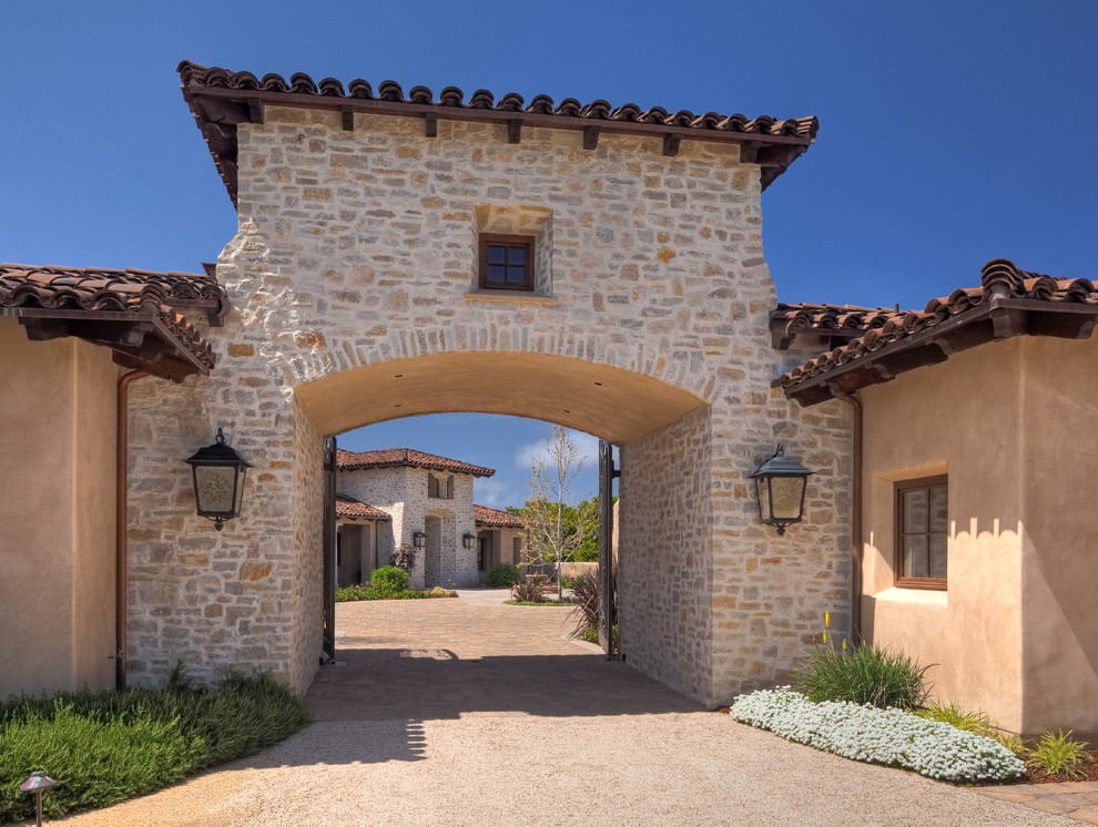 Mediterranean exterior in San Francisco with stone veneer and a tile roof.