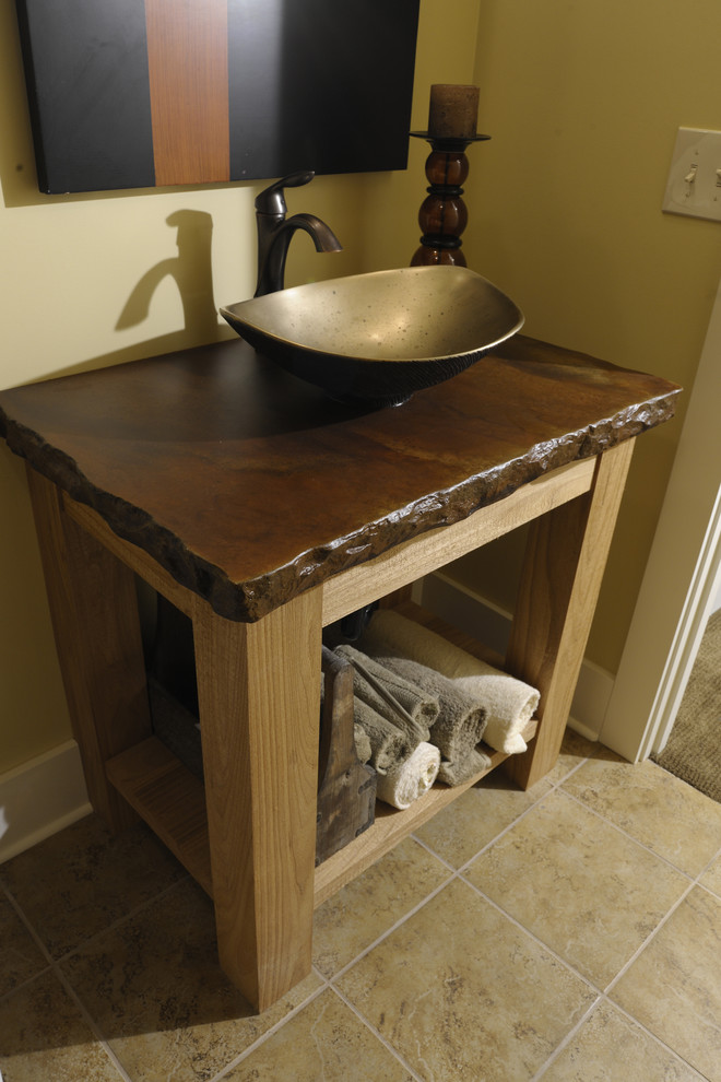 Design ideas for a traditional powder room in Columbus with stone slab, dark hardwood floors, a vessel sink, multi-coloured benchtops, a freestanding vanity and beige walls.
