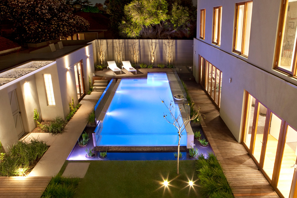 Inspiration for a mid-sized contemporary backyard rectangular aboveground pool in Melbourne with decking.