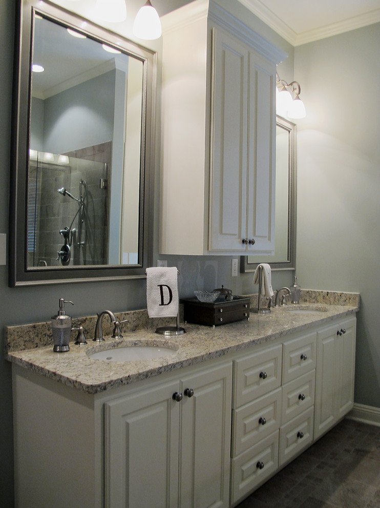 Inspiration for a large transitional master bathroom in Other with raised-panel cabinets, white cabinets, a drop-in tub, a corner shower, brown tile, stone tile, blue walls, ceramic floors, an undermount sink and engineered quartz benchtops.
