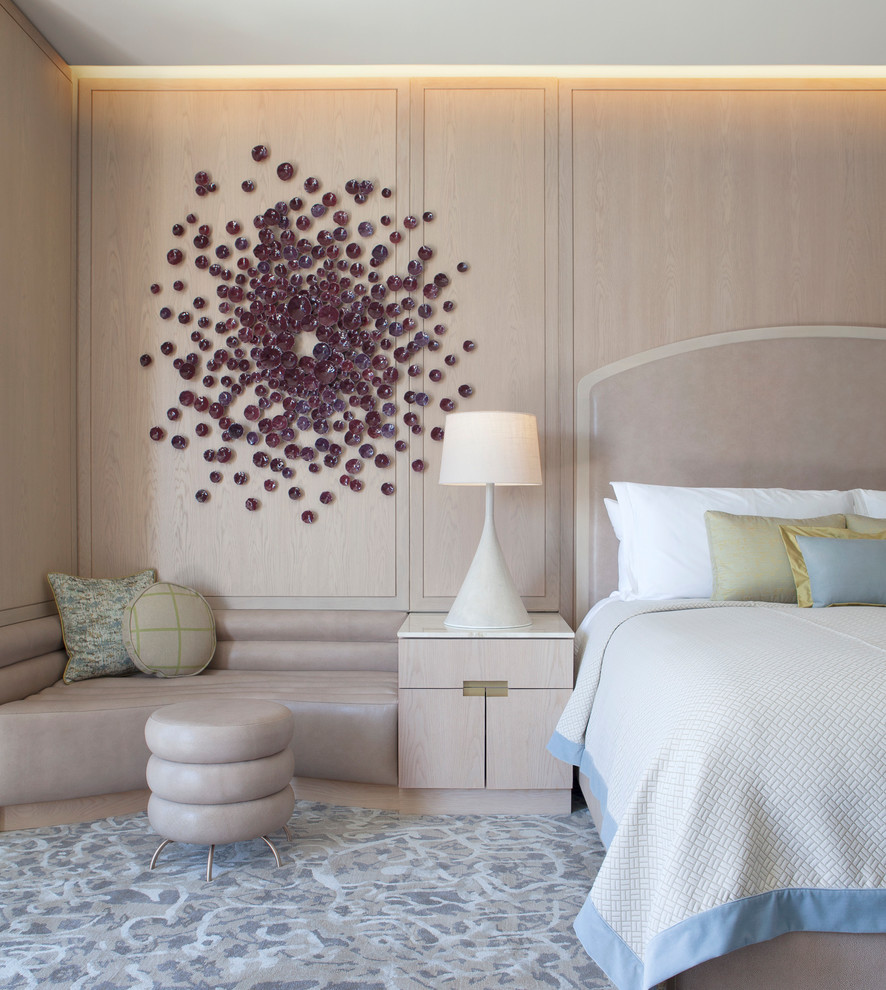 Contemporary bedroom in New York with beige walls, carpet and grey floor.