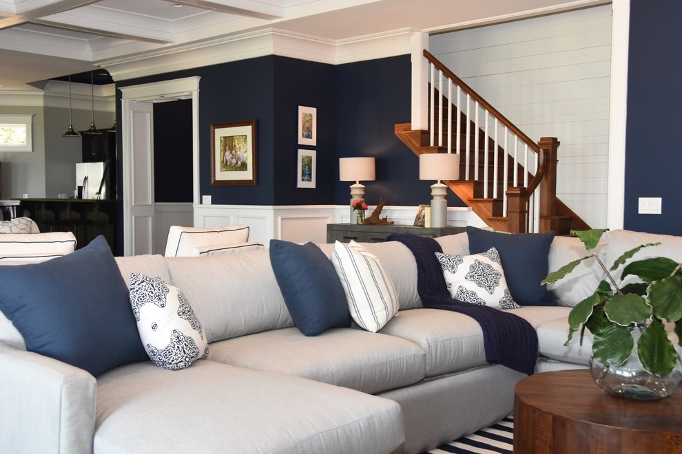 Inspiration for a large beach style basement in Charlotte with blue walls.