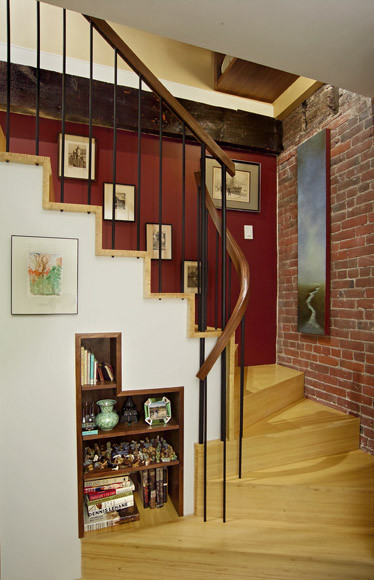 Inspiration for a small contemporary wood curved staircase in Boston with wood risers and wood railing.