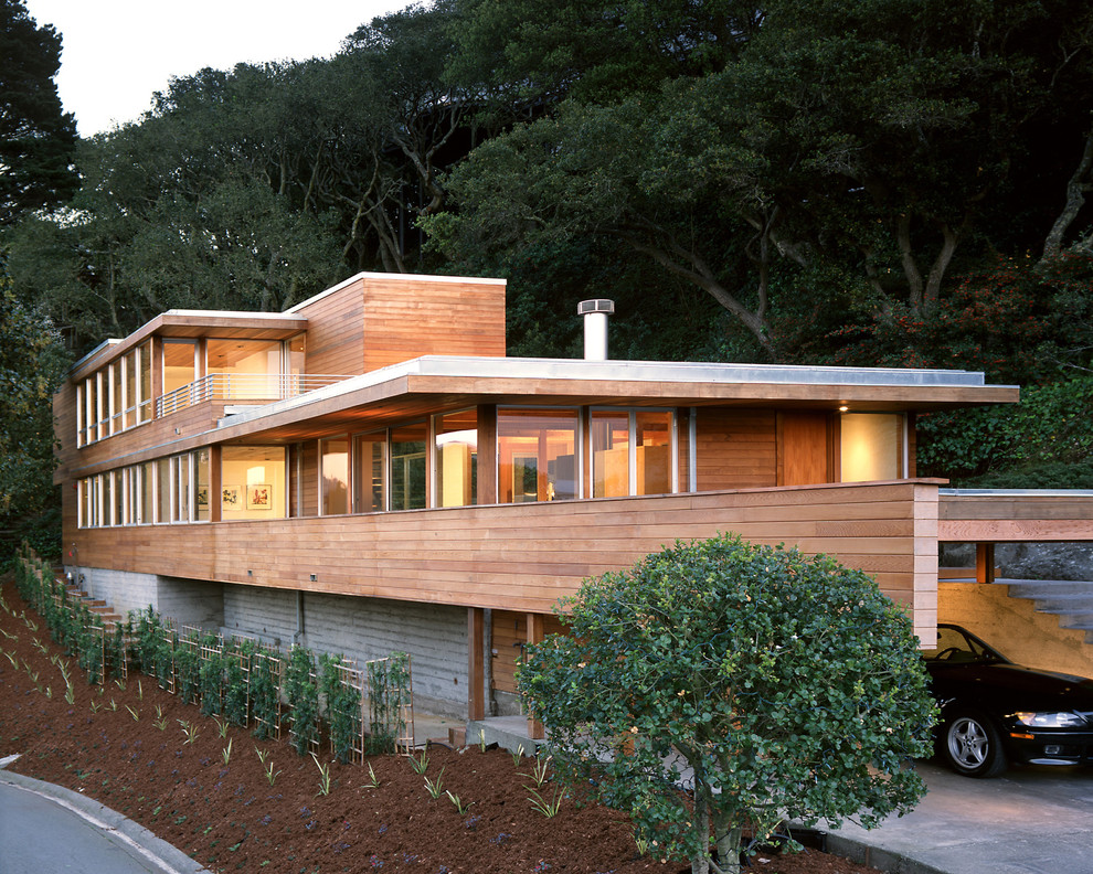 Design ideas for a mid-sized modern three-storey exterior in San Francisco with wood siding and a flat roof.