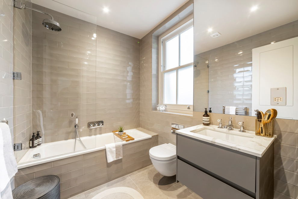 Inspiration for a contemporary bathroom in London with flat-panel cabinets, grey cabinets, an alcove tub, a shower/bathtub combo, gray tile, an undermount sink, grey floor, an open shower, white benchtops, a single vanity and a floating vanity.
