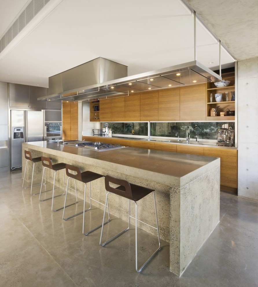 Inspiration for a large contemporary l-shaped open plan kitchen in Madrid with medium wood cabinets, stainless steel appliances and with island.