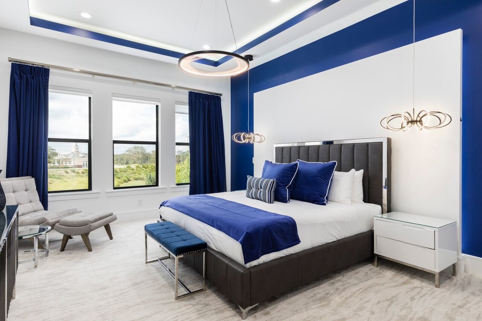 Contemporary bedroom in Orlando with white walls, carpet and grey floor.