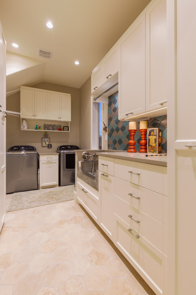 Design ideas for a large modern l-shaped utility room in Austin with an utility sink, shaker cabinets, white cabinets, quartz benchtops, beige walls and a side-by-side washer and dryer.
