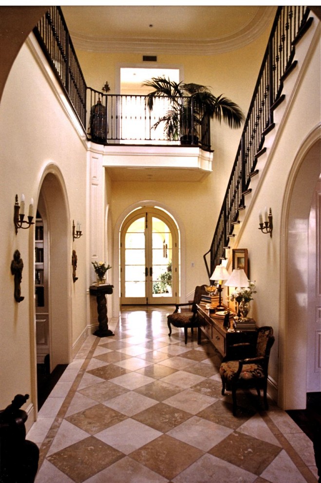 Inspiration for an expansive traditional foyer in Los Angeles with beige walls, marble floors, a double front door, a glass front door and beige floor.