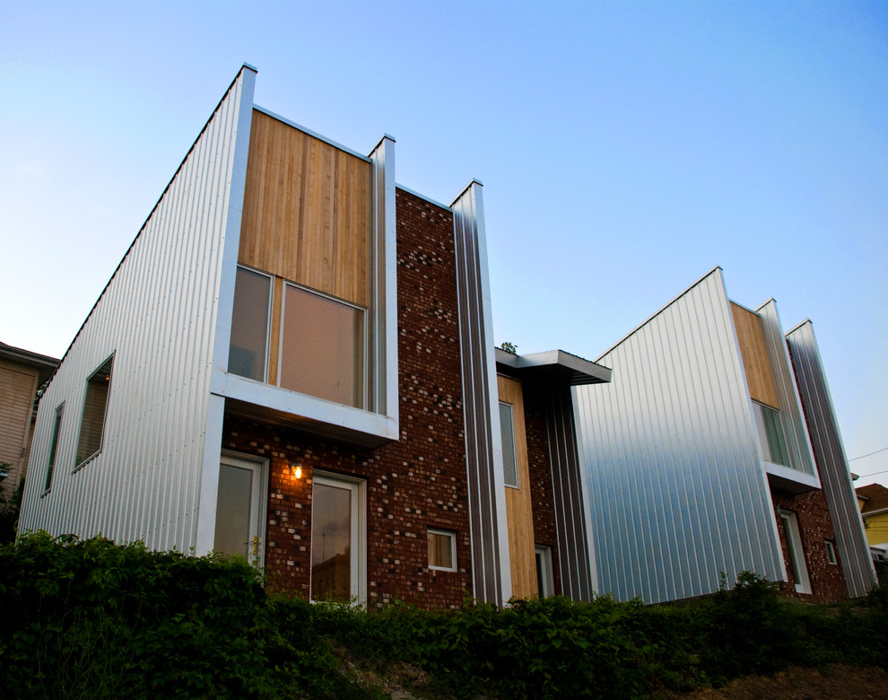 Inspiration for a contemporary exterior in Other with wood siding.