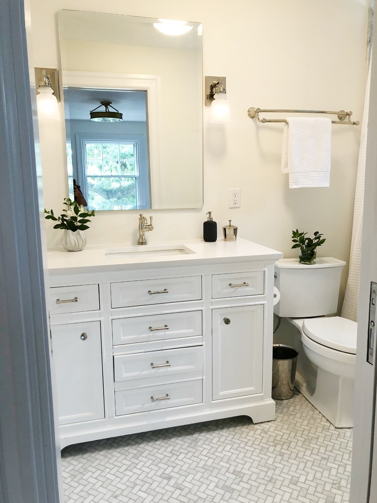 Inspiration for a small transitional master gray tile and marble tile marble floor and gray floor alcove shower remodel in Providence with furniture-like cabinets, white cabinets, white walls, an undermount sink, marble countertops and white countertops