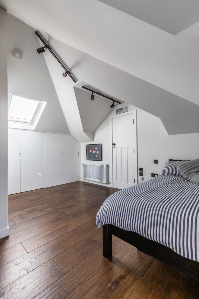 Design ideas for a medium sized traditional gender neutral teen’s room in London with white walls, dark hardwood flooring, brown floors and feature lighting.