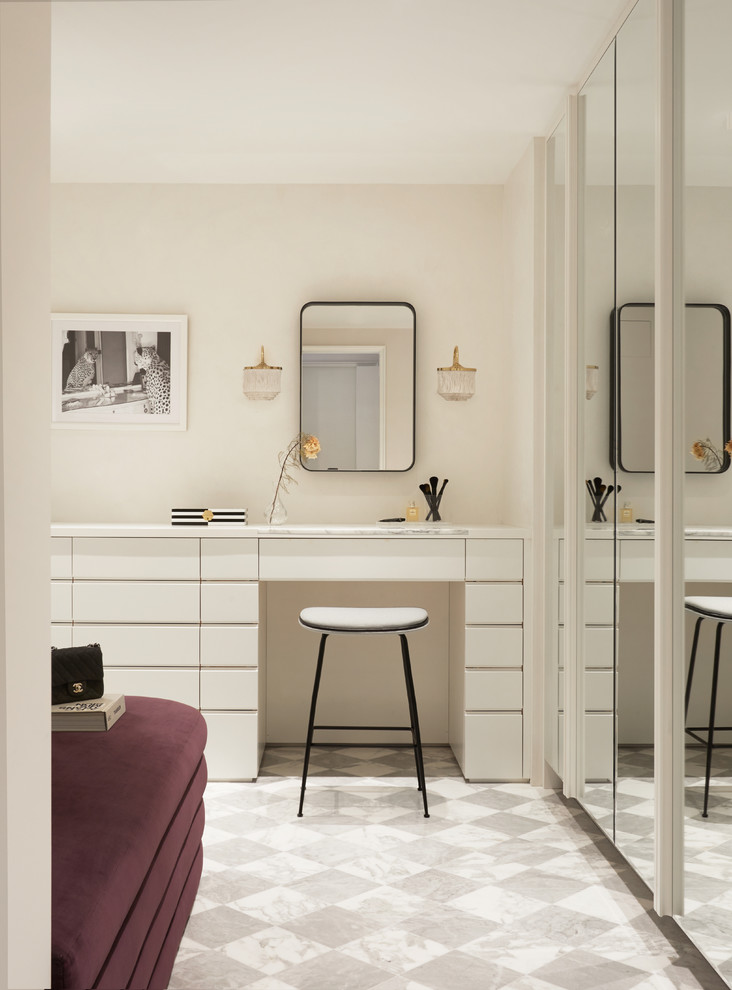 Design ideas for a contemporary women's dressing room in New York with flat-panel cabinets, white cabinets and multi-coloured floor.