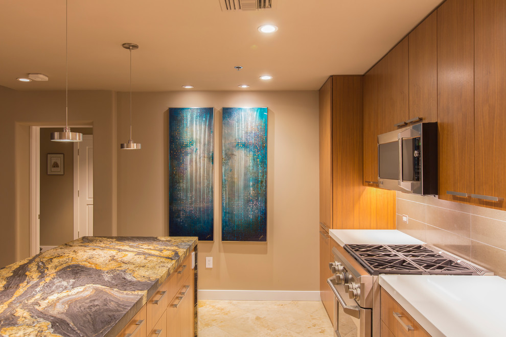 Example of a mid-sized transitional l-shaped travertine floor and beige floor enclosed kitchen design in Phoenix with an undermount sink, flat-panel cabinets, medium tone wood cabinets, onyx countertops, beige backsplash, porcelain backsplash, stainless steel appliances and an island