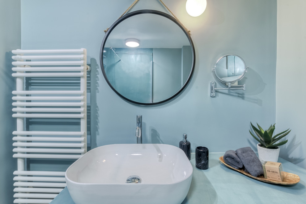Photo of a mid-sized contemporary master bathroom in Paris with turquoise cabinets, a curbless shower, a wall-mount toilet, brown tile, beige walls, concrete floors, a console sink, concrete benchtops, beige floor, turquoise benchtops, a laundry, a single vanity and a floating vanity.