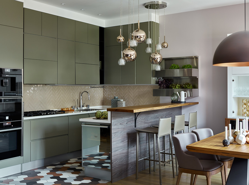 Design ideas for a mid-sized contemporary u-shaped eat-in kitchen in Moscow with a single-bowl sink, flat-panel cabinets, green cabinets, solid surface benchtops, ceramic splashback, porcelain floors, multi-coloured floor, white benchtop, beige splashback, black appliances and a peninsula.