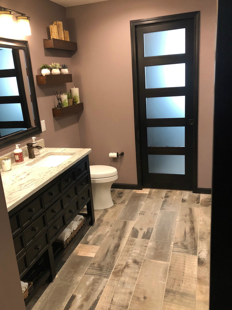 This is an example of a mid-sized asian master bathroom in Minneapolis with ceramic floors, recessed-panel cabinets, dark wood cabinets, brown walls, an undermount sink, granite benchtops, brown floor, a one-piece toilet, an alcove shower, brown tile, porcelain tile and an open shower.