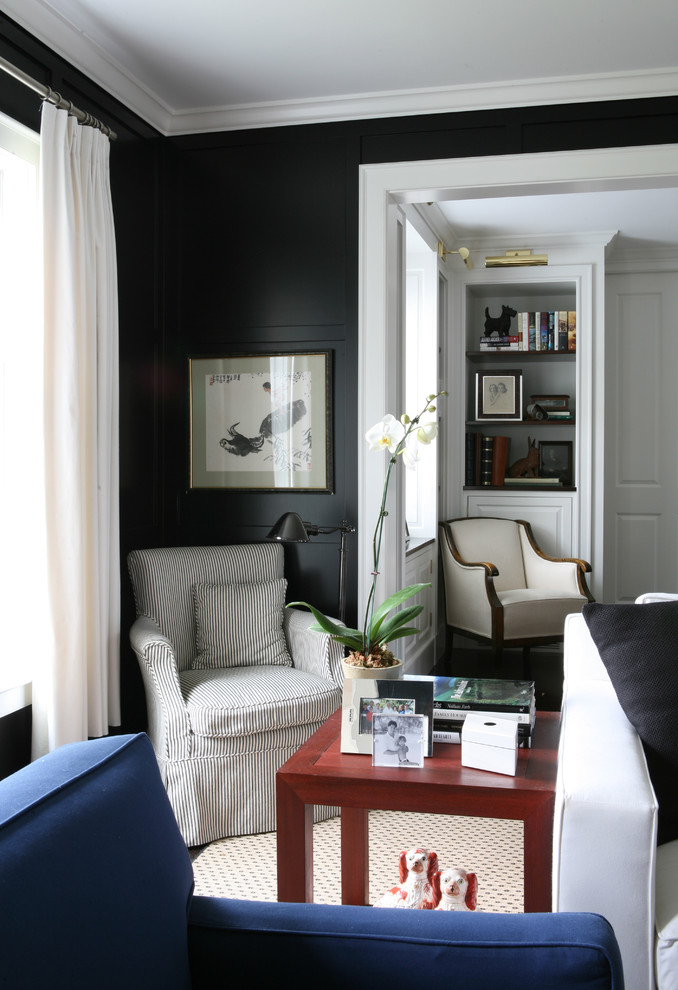 Design ideas for a traditional family room in Boston with black walls.