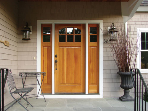 Inspiration for a large traditional two-storey grey exterior in Grand Rapids with wood siding.