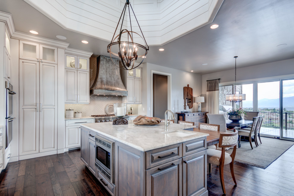 Example of a transitional home design design in Denver
