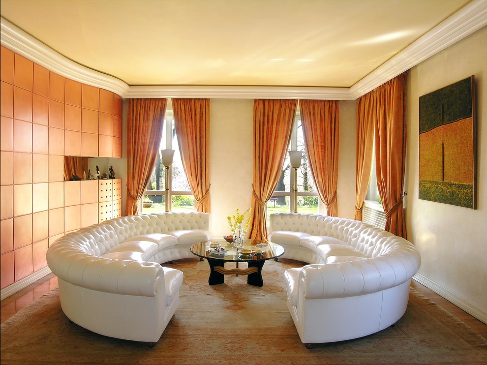 This is an example of a large traditional formal living room in Rome with beige walls and medium hardwood floors.