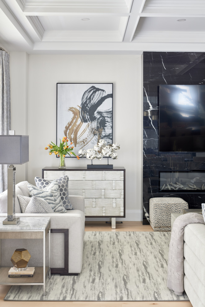 Mid-sized transitional enclosed family room in Toronto with medium hardwood floors, a standard fireplace, a metal fireplace surround, a wall-mounted tv, coffered and beige floor.