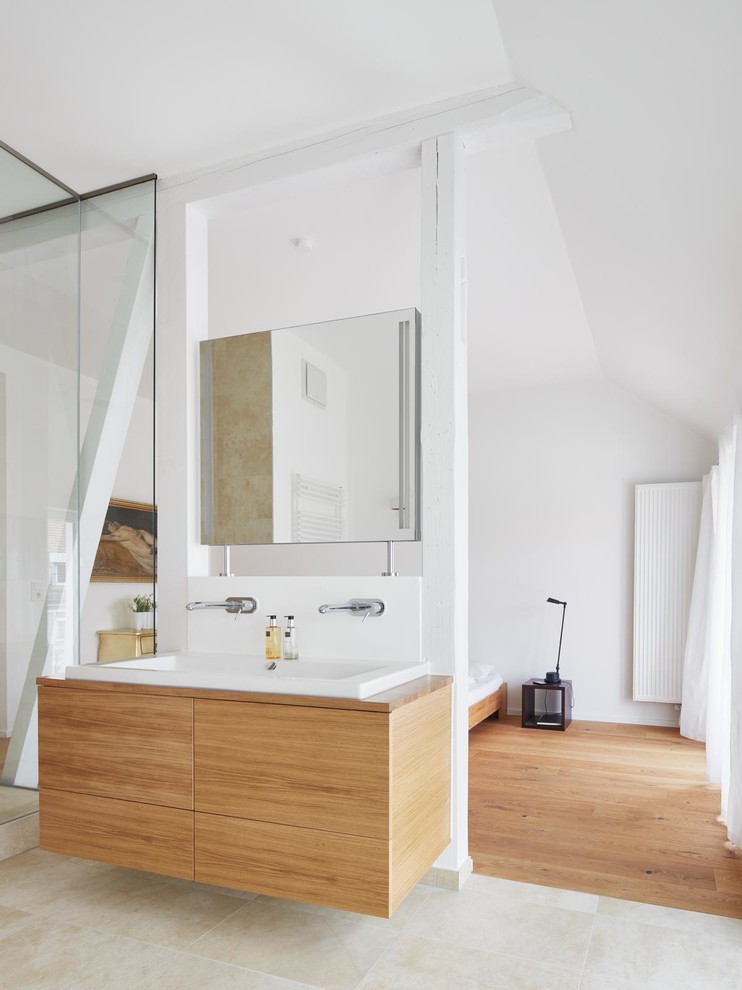 Design ideas for a contemporary master bathroom in Berlin with flat-panel cabinets, medium wood cabinets, white walls, a trough sink, a freestanding tub, beige tile, ceramic tile, ceramic floors, wood benchtops and an open shower.