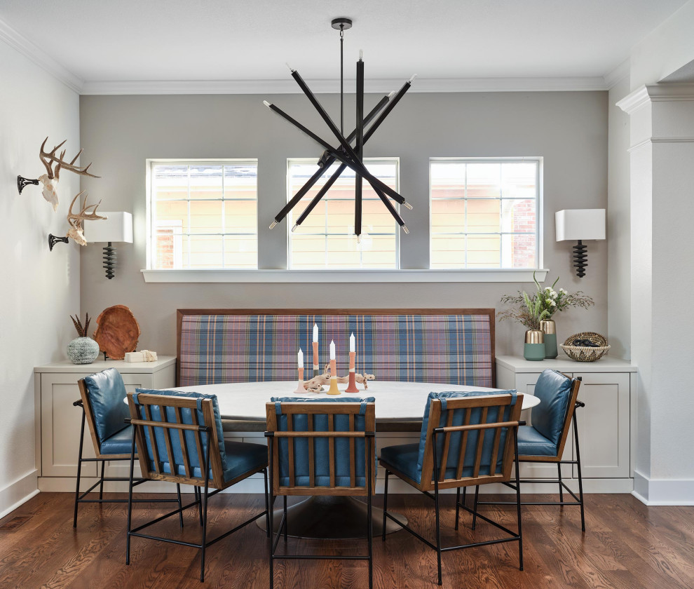 This is an example of a transitional dining room in Denver.