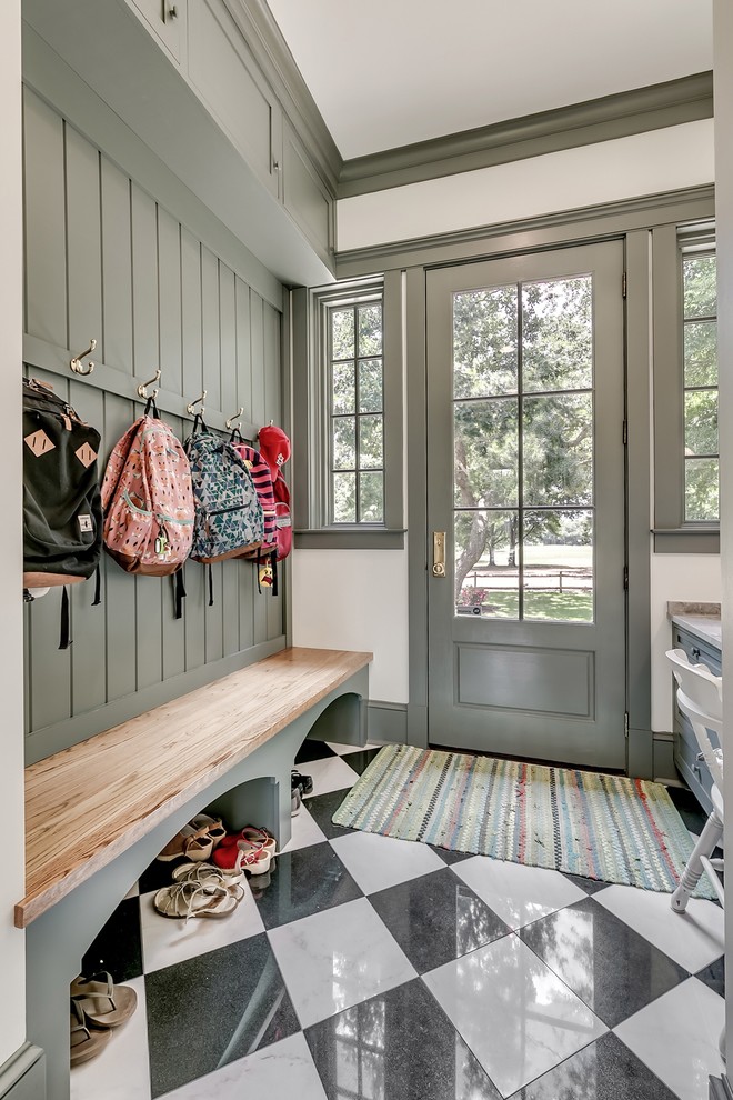 Photo of a country mudroom in Other with white walls, a single front door, a glass front door and multi-coloured floor.