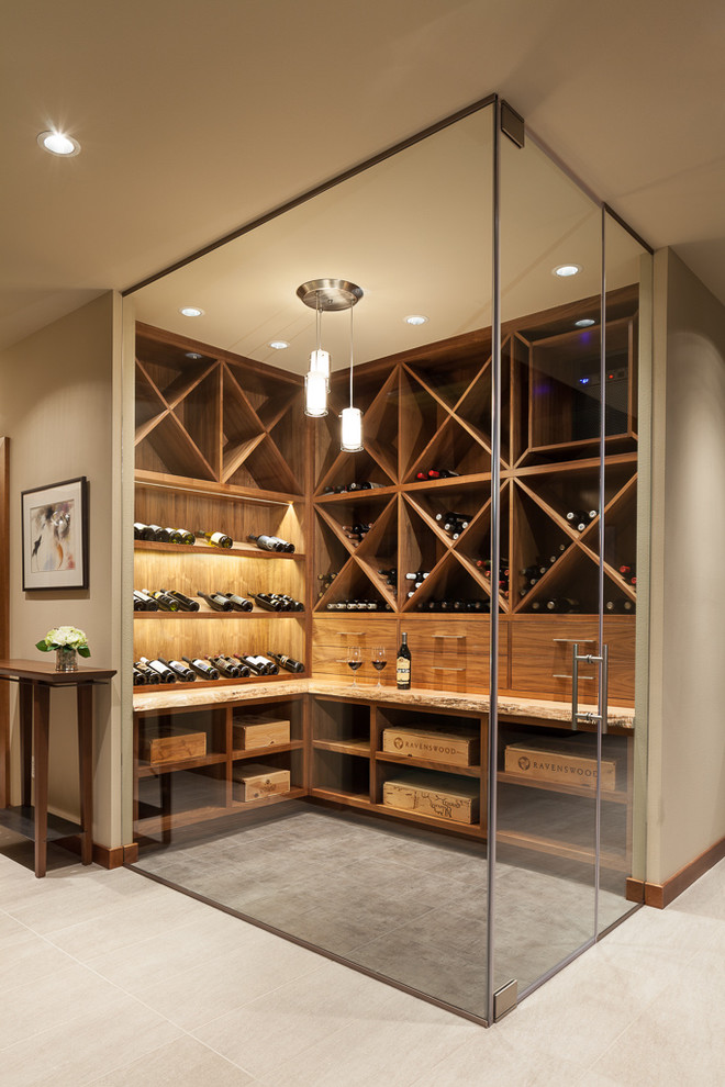 Inspiration for a mid-sized contemporary wine cellar in Seattle with porcelain floors, storage racks and grey floor.