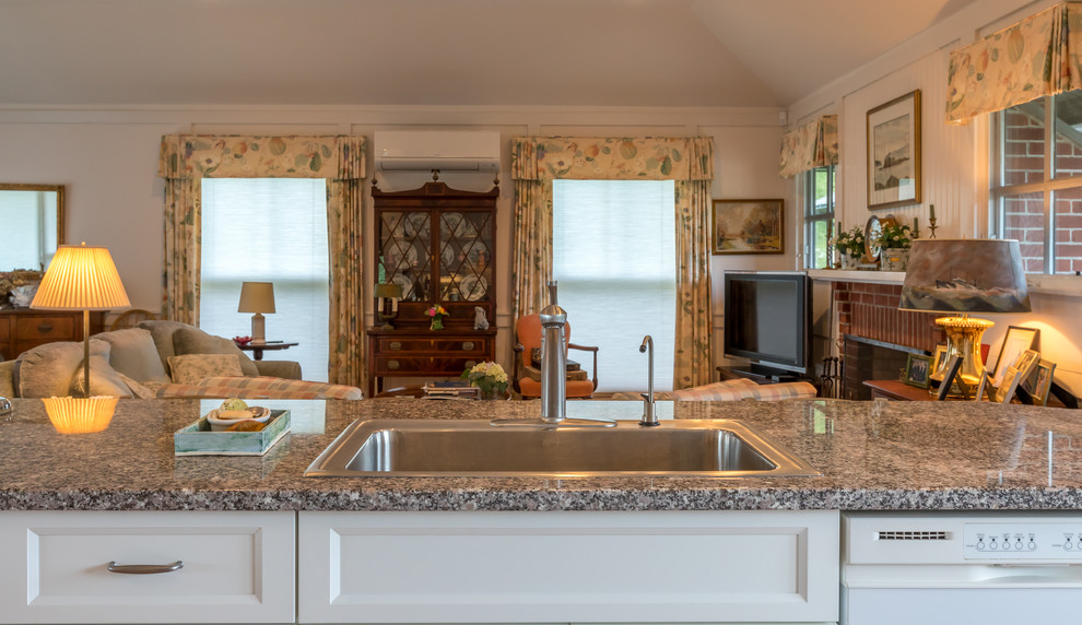 Example of a large transitional galley medium tone wood floor and brown floor enclosed kitchen design in Burlington with a drop-in sink, recessed-panel cabinets, white cabinets, granite countertops, stainless steel appliances and no island