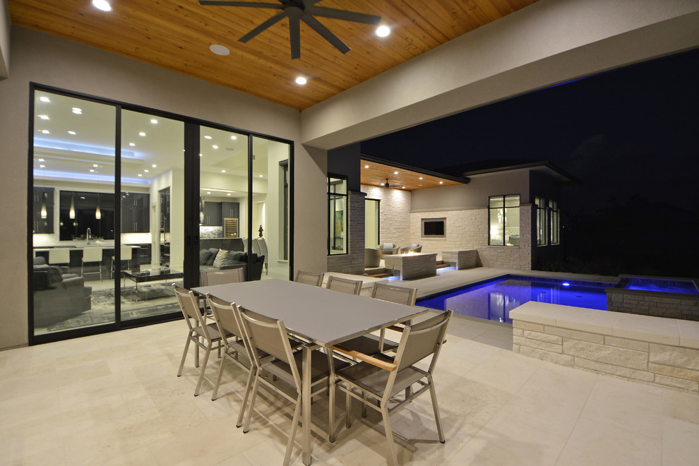 Design ideas for a contemporary backyard verandah in Austin with an outdoor kitchen.