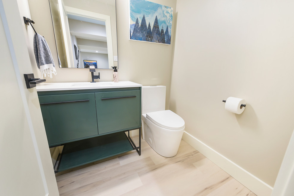 Inspiration for a mid-sized modern 3/4 bathroom in Other with beaded inset cabinets, green cabinets, a bidet, white walls, vinyl floors, a drop-in sink, marble benchtops, beige floor, white benchtops, a single vanity and a floating vanity.