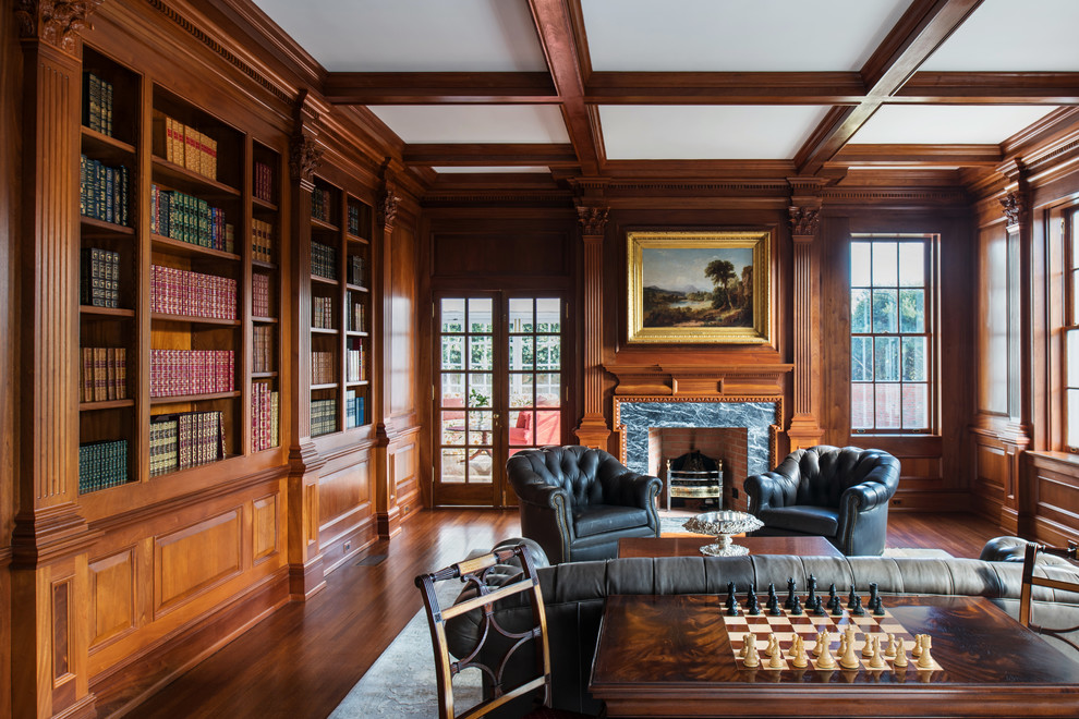 Large traditional home office in Richmond with a library, brown walls, dark hardwood floors, a standard fireplace, a stone fireplace surround and brown floor.