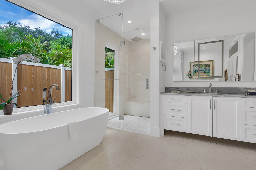 Inspiration for a large contemporary master bathroom in Other with shaker cabinets, white cabinets, a freestanding tub, an alcove shower, travertine floors, an undermount sink, beige floor, a hinged shower door, blue benchtops, a single vanity, a built-in vanity and coffered.