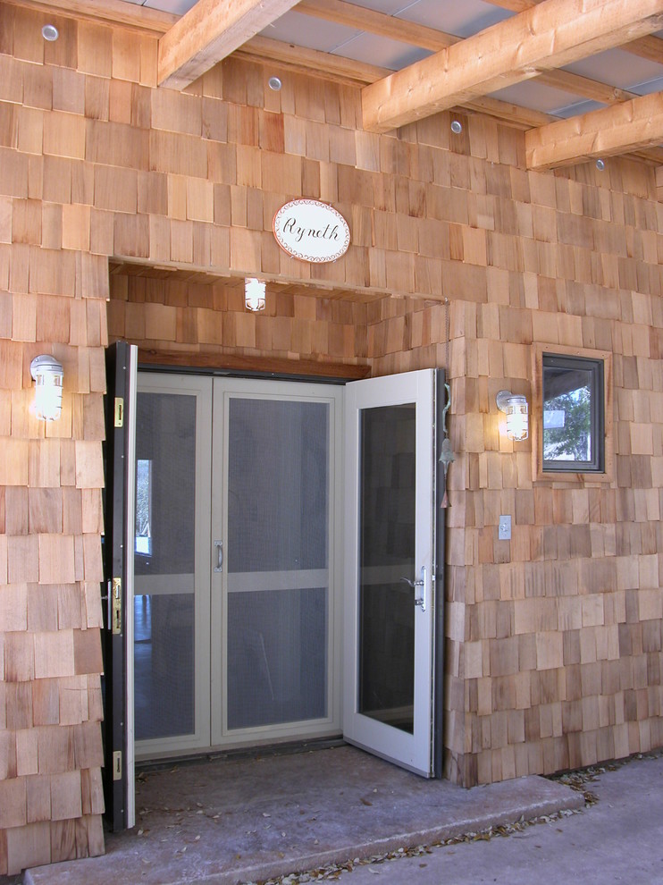 Inspiration for a rustic entryway remodel in Austin