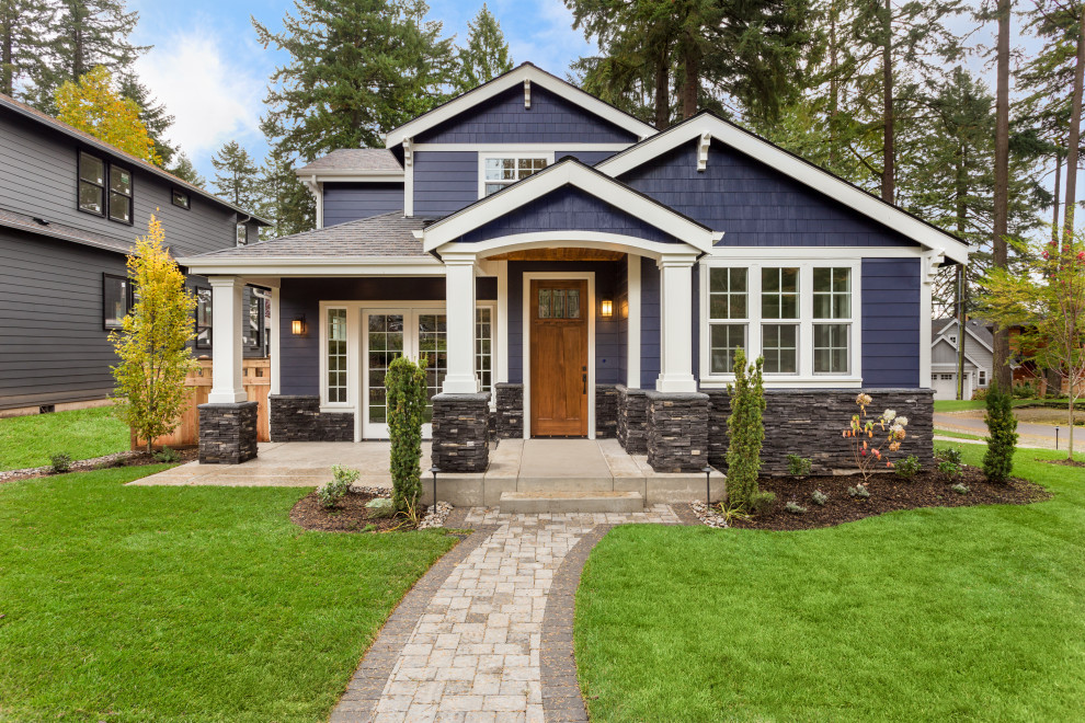 Elegant blue two-story board and batten and shingle exterior home photo in Salt Lake City with a shingle roof and a gray roof