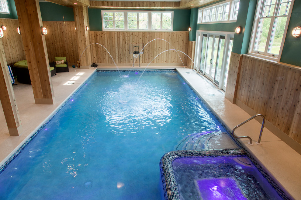 Inspiration for a large transitional backyard concrete paver and rectangular lap hot tub remodel