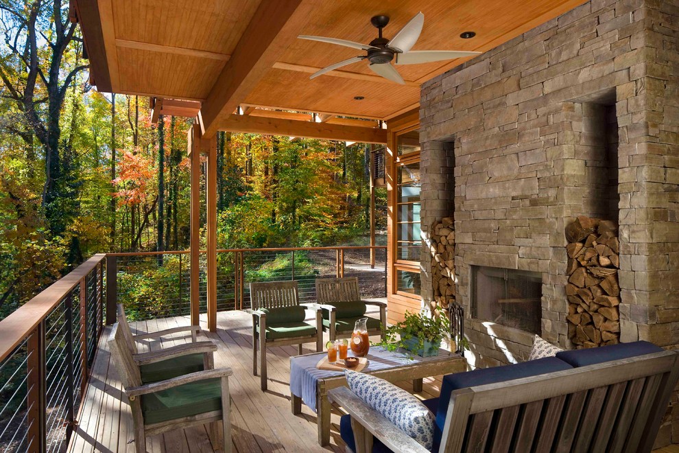 Inspiration for a large country backyard verandah in Atlanta with a fire feature, decking and a roof extension.
