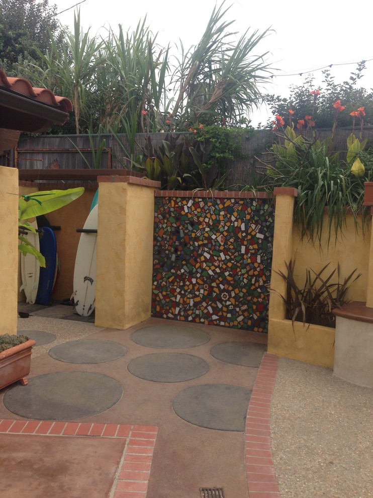 Inspiration for a mid-sized eclectic backyard patio in Los Angeles with no cover.
