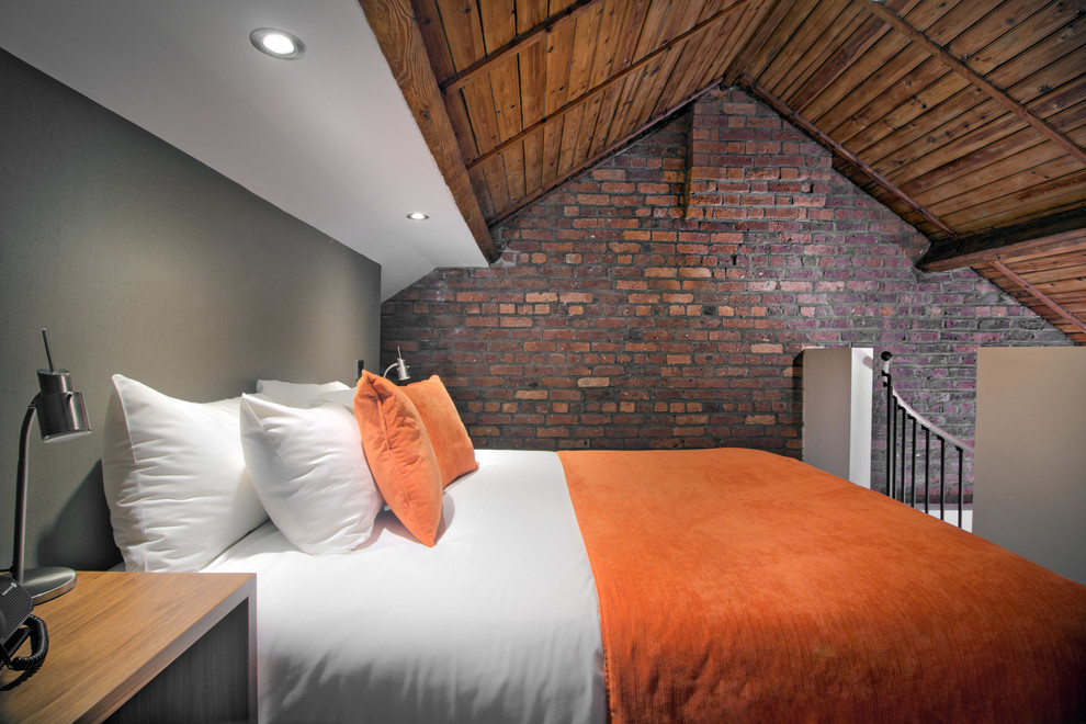 Design ideas for an expansive modern loft-style bedroom in Cheshire with multi-coloured walls.