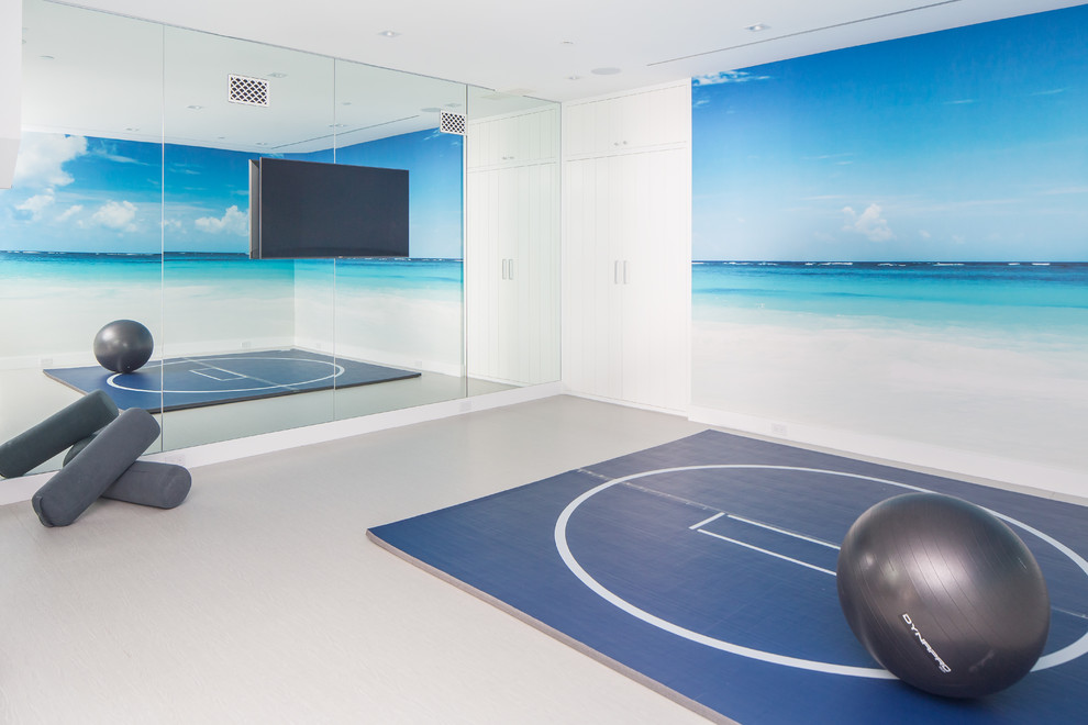 Beach style home gym in Orange County with white walls and grey floor.