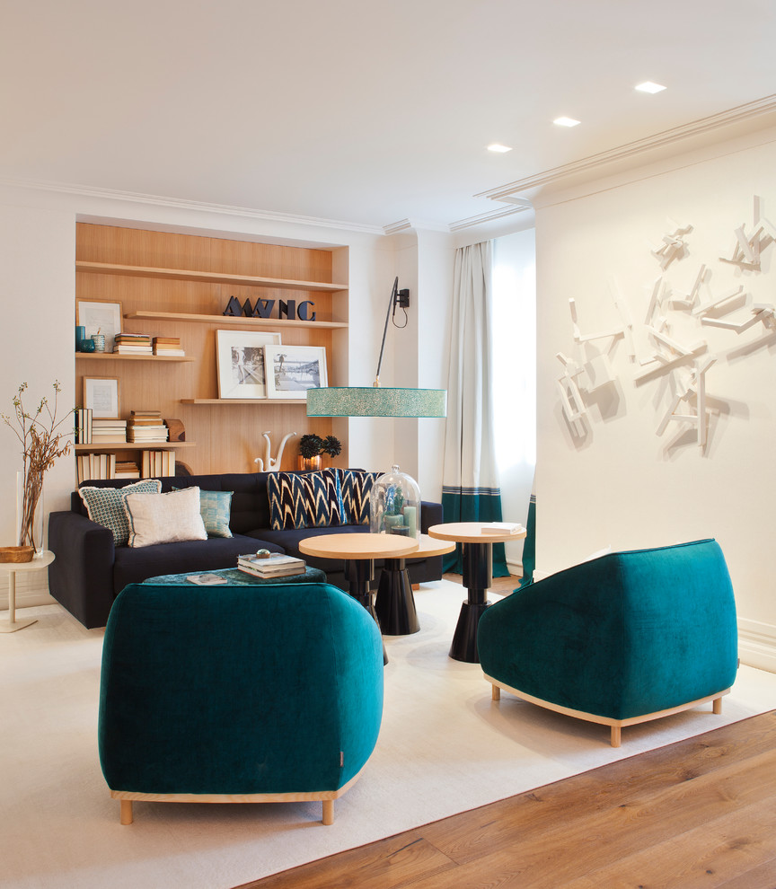Large trendy formal and open concept medium tone wood floor living room photo in Madrid with white walls, no fireplace and no tv