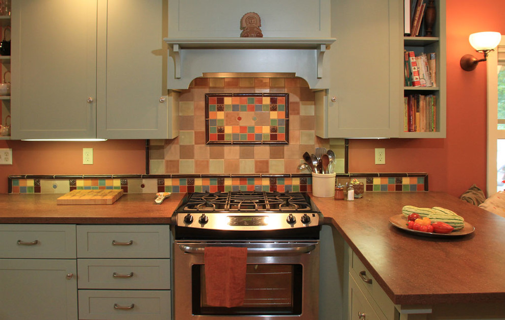 Photo of an eclectic kitchen in New York with multi-coloured splashback, ceramic splashback and stainless steel appliances.