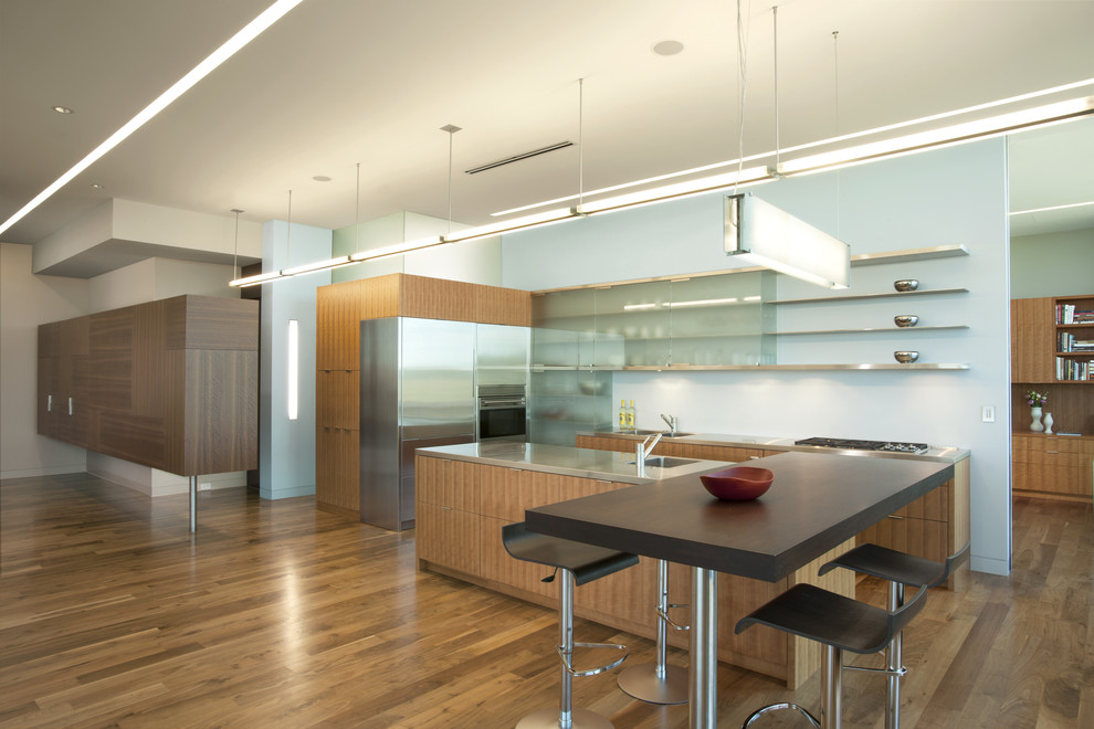 Modern kitchen in Minneapolis with stainless steel benchtops.