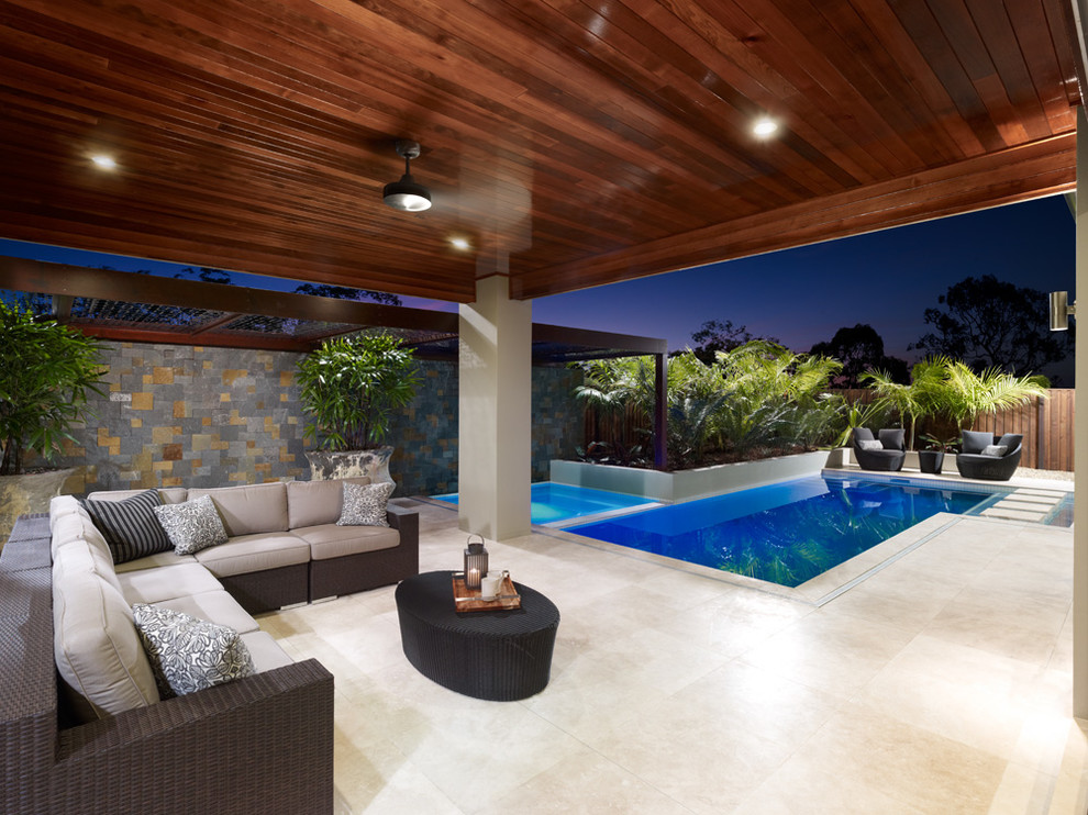 Photo of a tropical rectangular pool in Brisbane.